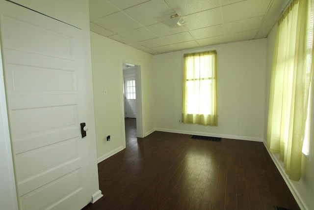 552 Southwood Ave, Columbus, OH 43207 - empty room featuring a paneled ceiling and dark wood-style flooring