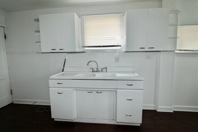552 Southwood Ave, Columbus, OH 43207 - kitchen featuring open shelves, light countertops, white cabinetry, and wainscoting