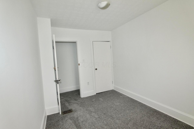 552 Southwood Ave, Columbus, OH 43207 - unfurnished bedroom featuring dark colored carpet and baseboards