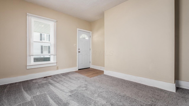64 W Harrison St, Newark, OH 43055 - entrance foyer with carpet flooring and baseboards