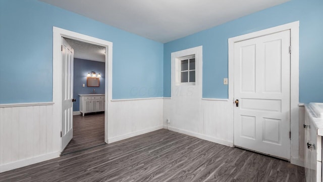 64 W Harrison St, Newark, OH 43055 - spare room featuring wainscoting and dark wood finished floors