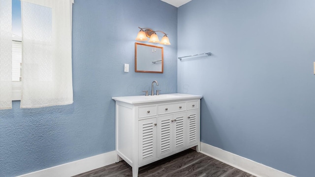 64 W Harrison St, Newark, OH 43055 - bathroom featuring wood finished floors and vanity