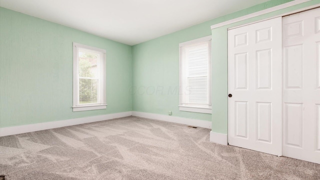 64 W Harrison St, Newark, OH 43055 - unfurnished bedroom featuring carpet and a closet