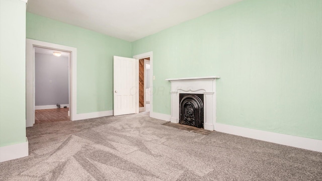 64 W Harrison St, Newark, OH 43055 - unfurnished living room with carpet floors and a fireplace with flush hearth