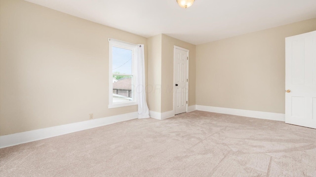 64 W Harrison St, Newark, OH 43055 - empty room featuring light carpet and baseboards