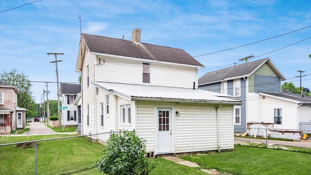 64 W Harrison St, Newark, OH 43055 - back of house featuring a chimney