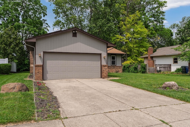 2220 Surreygate Dr, Columbus, OH 43235 - ranch-style house with brick siding, concrete driveway, and an attached garage