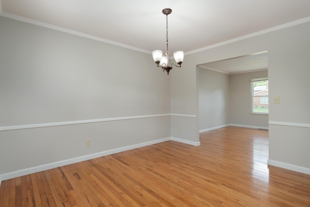 2220 Surreygate Dr, Columbus, OH 43235 - empty room with light wood-type flooring, a chandelier, and crown molding