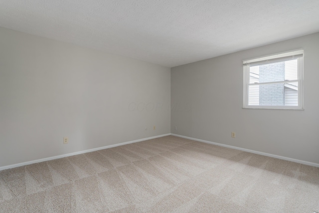 2220 Surreygate Dr, Columbus, OH 43235 - unfurnished room with light colored carpet and a textured ceiling