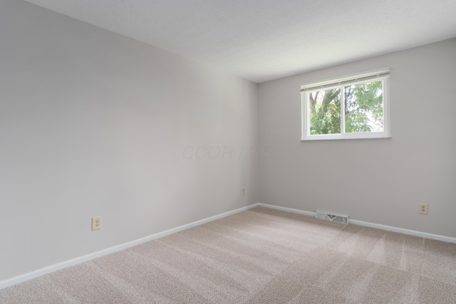 2220 Surreygate Dr, Columbus, OH 43235 - spare room featuring carpet flooring and baseboards