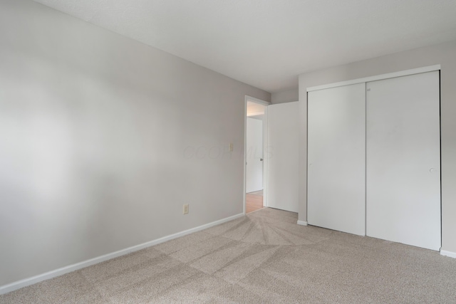2220 Surreygate Dr, Columbus, OH 43235 - unfurnished bedroom with carpet floors and a closet