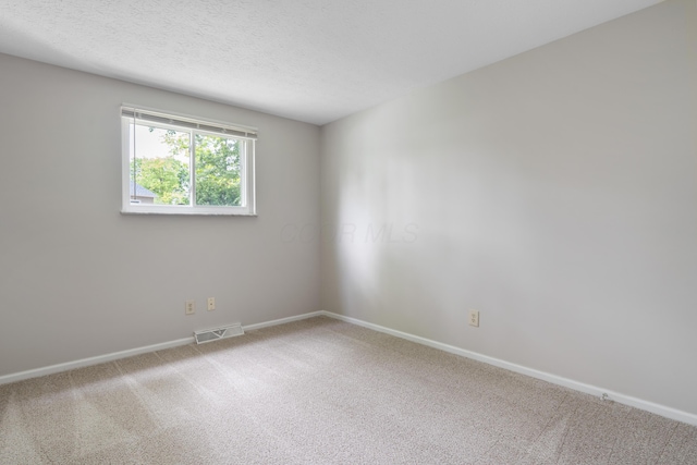 2220 Surreygate Dr, Columbus, OH 43235 - carpeted spare room featuring baseboards and a textured ceiling