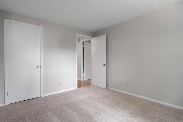 2220 Surreygate Dr, Columbus, OH 43235 - unfurnished bedroom featuring carpet flooring and baseboards