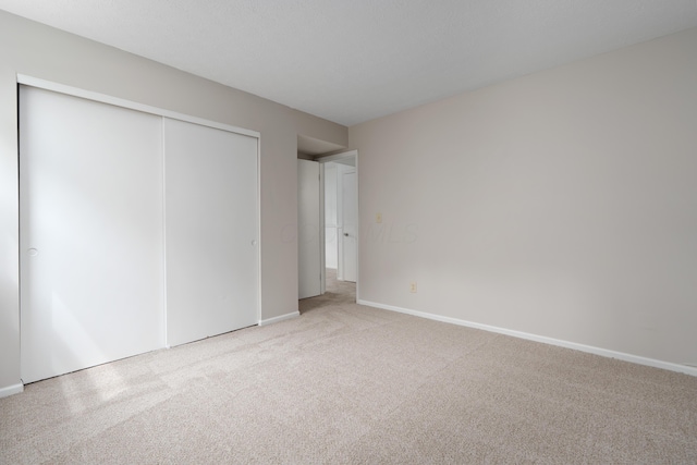2220 Surreygate Dr, Columbus, OH 43235 - unfurnished bedroom with carpet and a closet