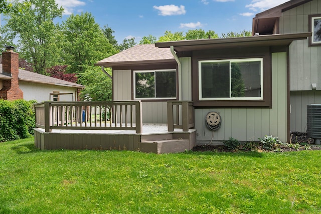 2220 Surreygate Dr, Columbus, OH 43235 - back of property with a deck, a yard, and roof with shingles