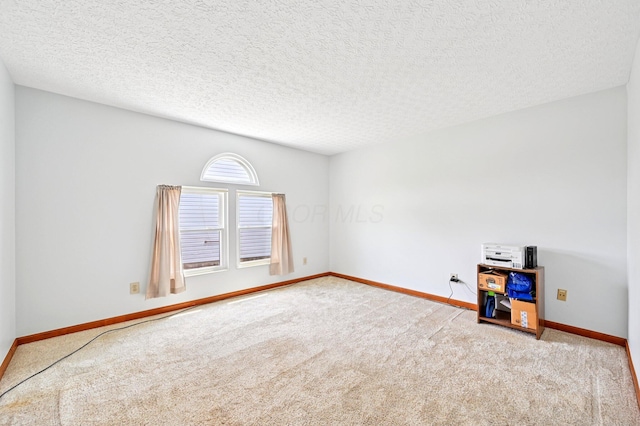 5138 Eastbend Dr, Canal Winchester, OH 43110 - carpeted empty room with baseboards and a textured ceiling