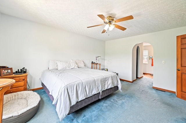 5138 Eastbend Dr, Canal Winchester, OH 43110 - bedroom featuring arched walkways, carpet, a ceiling fan, and a textured ceiling
