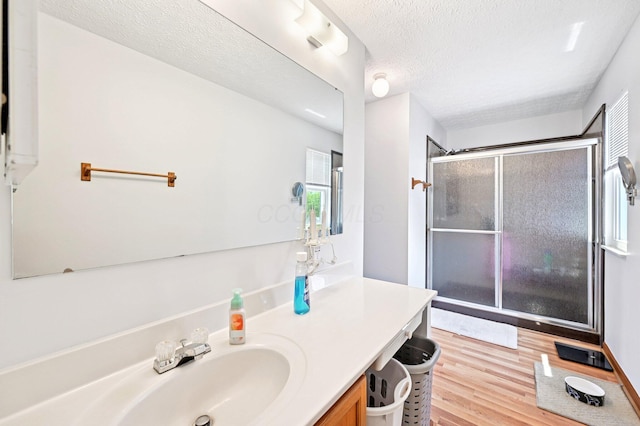 5138 Eastbend Dr, Canal Winchester, OH 43110 - full bath featuring vanity, a shower stall, wood finished floors, and a textured ceiling