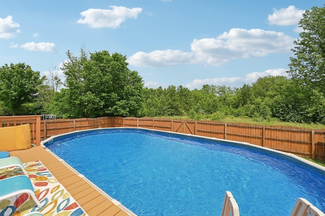 5138 Eastbend Dr, Canal Winchester, OH 43110 - view of swimming pool with a fenced backyard and a wooden deck