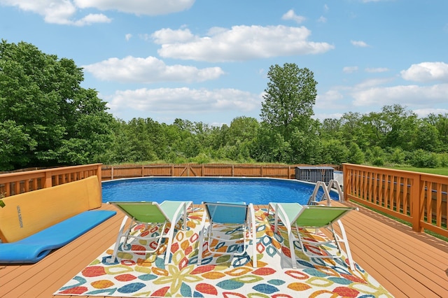 5138 Eastbend Dr, Canal Winchester, OH 43110 - view of swimming pool with a wooden deck and view of scattered trees