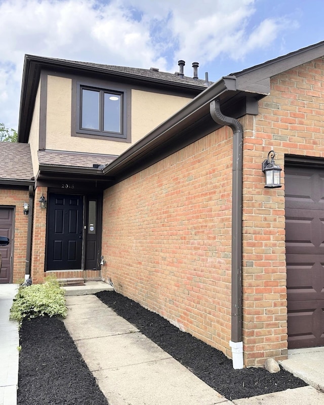 2016 Queensgate Ln, Columbus, OH 43235 - view of exterior entry featuring brick siding and stucco siding