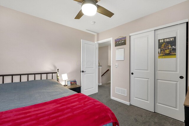 202 Rosewood Loop SW, Commercial Point, OH 43116 - bedroom with dark colored carpet, baseboards, a closet, and a ceiling fan