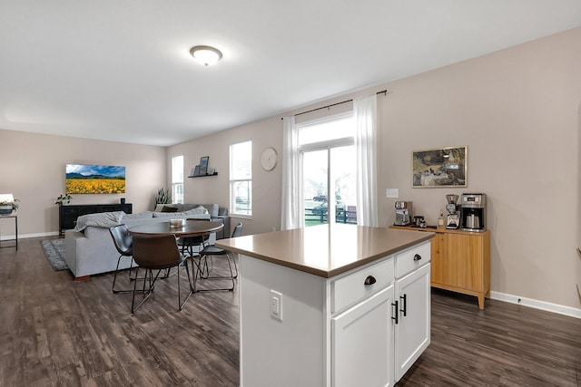 202 Rosewood Loop SW, Commercial Point, OH 43116 - kitchen featuring dark wood finished floors, white cabinetry, a center island, and baseboards
