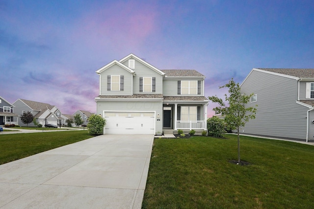 202 Rosewood Loop SW, Commercial Point, OH 43116 - traditional home featuring concrete driveway, a yard, covered porch, a garage, and roof with shingles