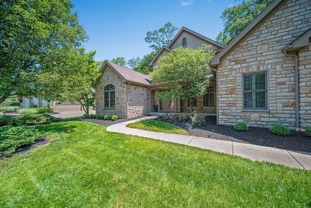 7788 Boylston Ct, Dublin, OH 43016 - view of front facade featuring stone siding and a front yard
