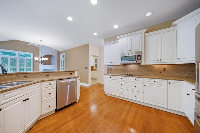 7788 Boylston Ct, Dublin, OH 43016 - kitchen with stainless steel appliances, a chandelier, tasteful backsplash, white cabinets, and light wood finished floors
