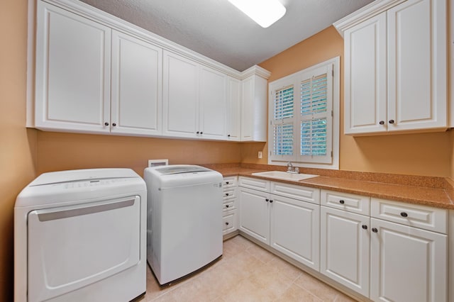 7788 Boylston Ct, Dublin, OH 43016 - laundry area featuring cabinet space and washer and clothes dryer