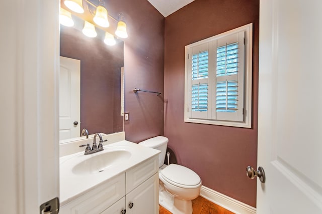 7788 Boylston Ct, Dublin, OH 43016 - half bathroom featuring vanity and wood finished floors