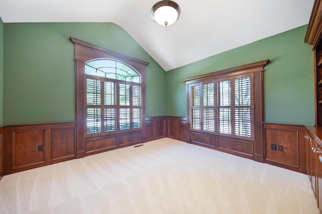 7788 Boylston Ct, Dublin, OH 43016 - carpeted spare room with a wainscoted wall and lofted ceiling
