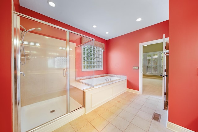 7788 Boylston Ct, Dublin, OH 43016 - full bathroom with a garden tub, a stall shower, tile patterned floors, and recessed lighting