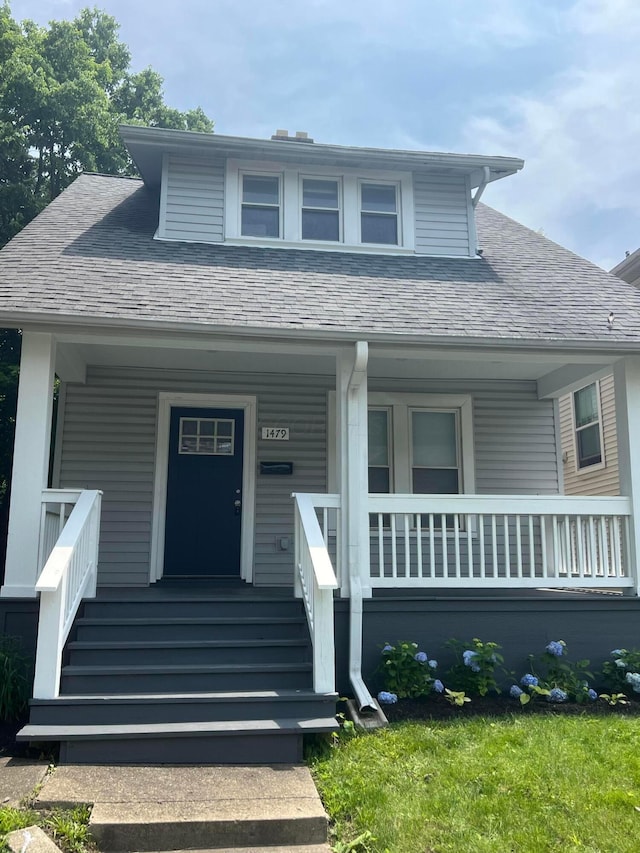 1476 N 6th St, Columbus, OH 43201 - bungalow-style home featuring covered porch and roof with shingles