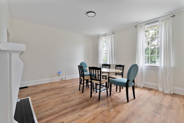 490 E Mithoff St, Columbus, OH 43206 - dining room with light wood-style flooring, plenty of natural light, and baseboards