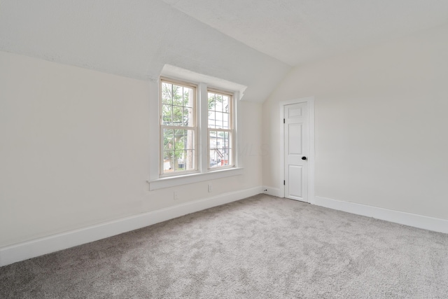 490 E Mithoff St, Columbus, OH 43206 - additional living space with lofted ceiling, carpet floors, and baseboards