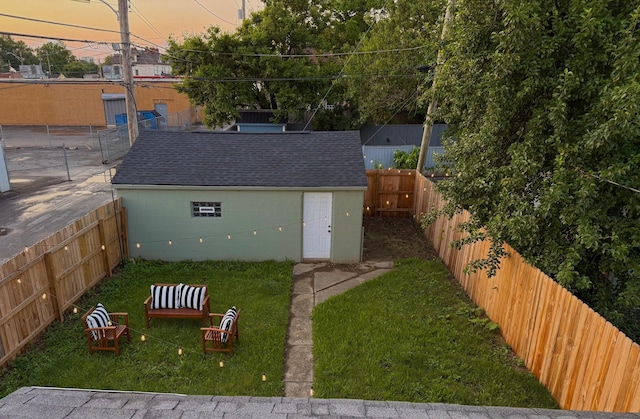 490 E Mithoff St, Columbus, OH 43206 - yard at dusk featuring an outbuilding