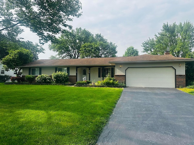 9747 Shalemar Dr, Pickerington, OH 43147 - single story home with brick siding, driveway, a garage, a chimney, and a front yard