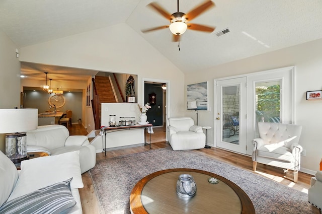 6235 Hampton Green Pl Unit 5B, Dublin, OH 43016 - living area with a ceiling fan, wood finished floors, high vaulted ceiling, and a chandelier