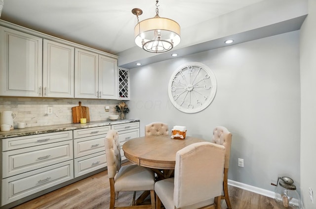 6235 Hampton Green Pl Unit 5B, Dublin, OH 43016 - dining room featuring light wood-style floors, a chandelier, and recessed lighting
