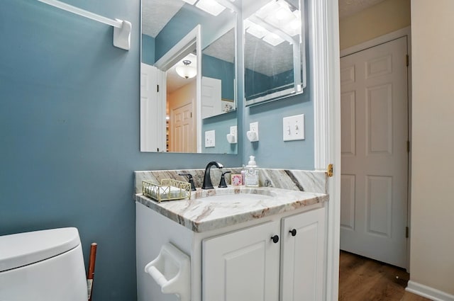 6235 Hampton Green Pl Unit 5B, Dublin, OH 43016 - half bath with vanity and wood finished floors