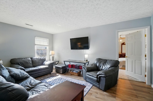 6235 Hampton Green Pl Unit 5B, Dublin, OH 43016 - living area with wood finished floors and a textured ceiling