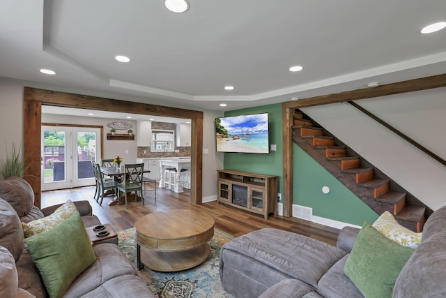 1859 State Route 257 N, Ostrander, OH 43061 - living area with recessed lighting, stairs, a tray ceiling, wood finished floors, and french doors