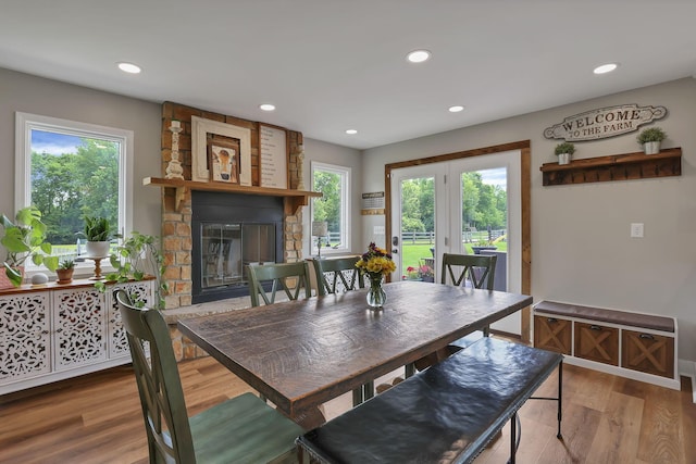 1859 State Route 257 N, Ostrander, OH 43061 - dining area featuring wood finished floors, plenty of natural light, a fireplace, and recessed lighting