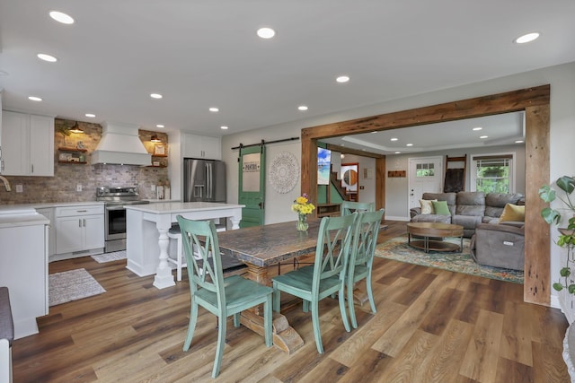 1859 State Route 257 N, Ostrander, OH 43061 - dining space with a barn door, wood finished floors, and recessed lighting
