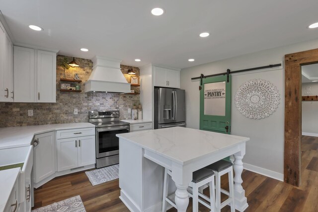 1859 State Route 257 N, Ostrander, OH 43061 - kitchen featuring stainless steel appliances, premium range hood, open shelves, backsplash, and a barn door