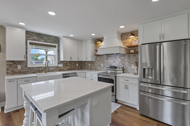 1859 State Route 257 N, Ostrander, OH 43061 - kitchen with appliances with stainless steel finishes, premium range hood, backsplash, white cabinets, and recessed lighting