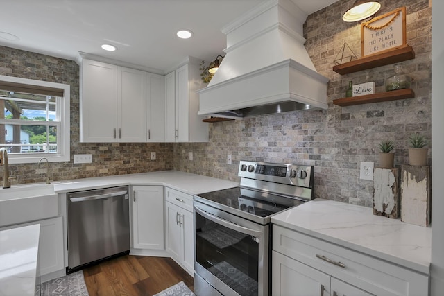 1859 State Route 257 N, Ostrander, OH 43061 - kitchen with appliances with stainless steel finishes, custom exhaust hood, tasteful backsplash, open shelves, and white cabinets