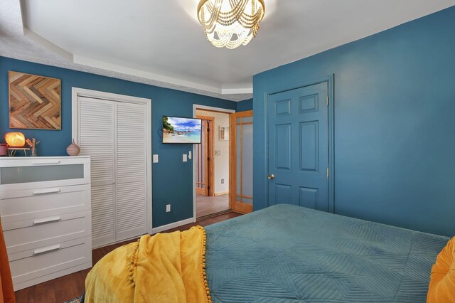 1859 State Route 257 N, Ostrander, OH 43061 - bedroom with wood finished floors, a chandelier, and a tray ceiling